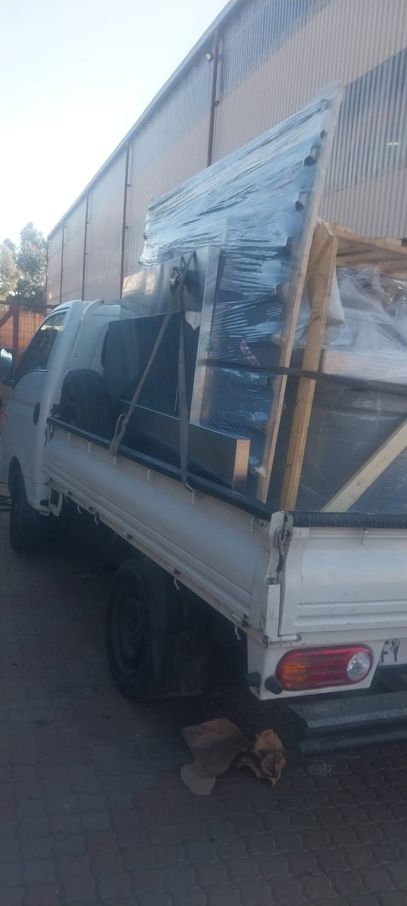 Loaded Mj Movers truck ready for delivery